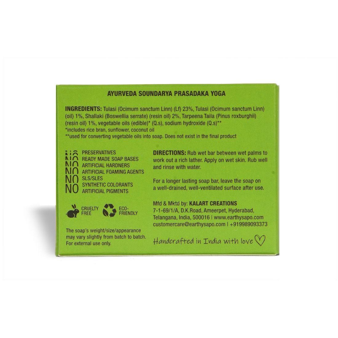 Earthy Sapo Tulsi Freshness Bathing Soap bar with fresh tulsi leaves.