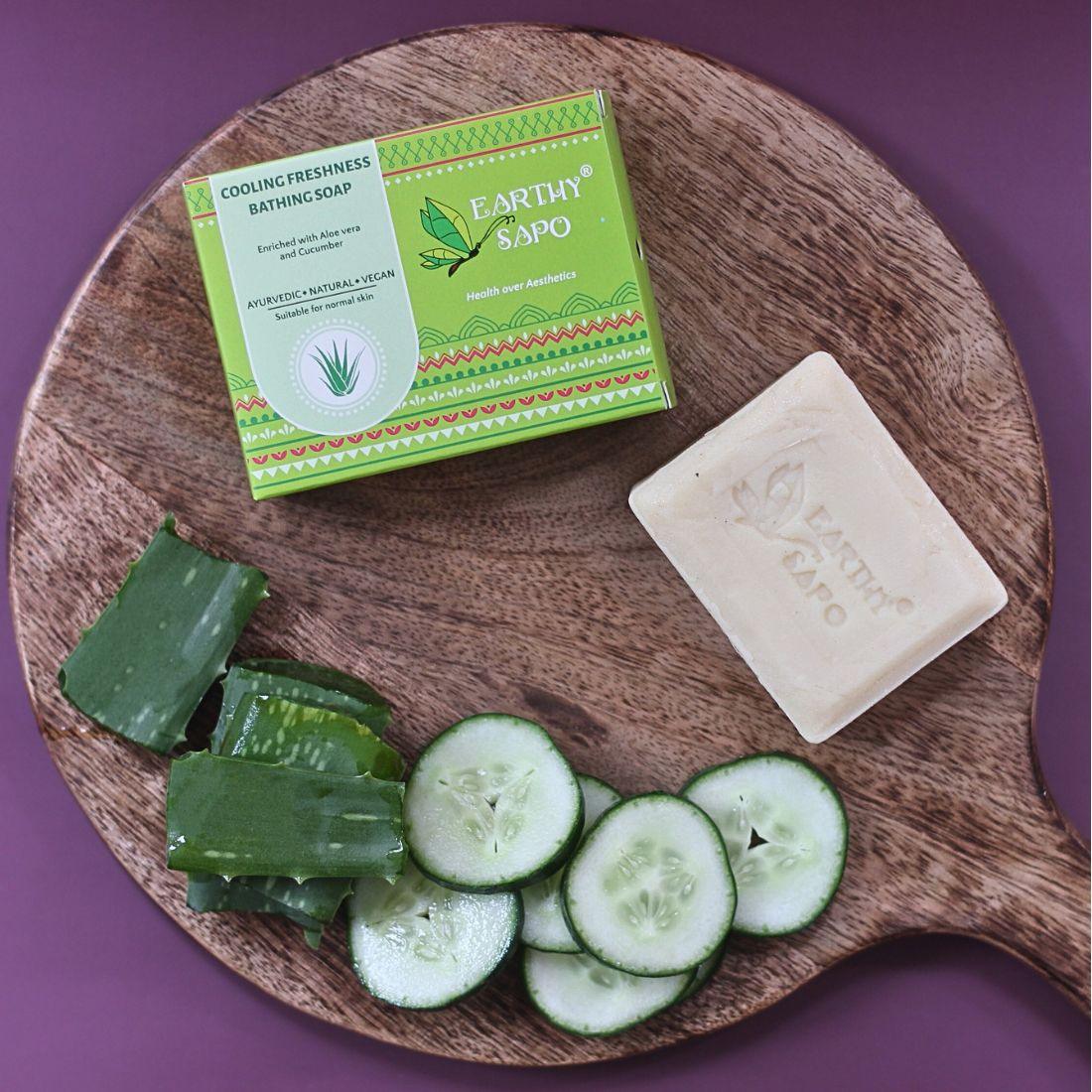 Earthy Sapo Cooling Freshness Bathing Soap with aloe vera and cucumber, shown with fresh aloe vera leaves and cucumber slices