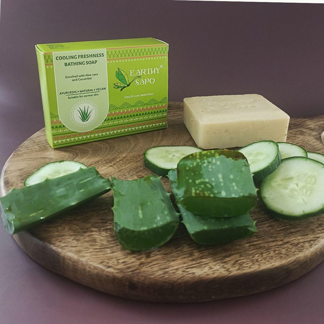 Earthy Sapo Cooling Freshness Bathing Soap with aloe vera and cucumber, shown with fresh aloe vera leaves and cucumber slices