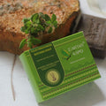 Earthy Sapo Tulsi Freshness Bathing Soap with fresh tulsi leaves and a handmade soap bar.
