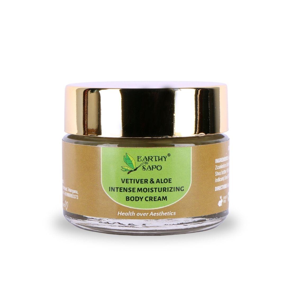 Earthy Sapo Vetiver & Aloe Intense Moisturizing Body Cream in a glass jar with a gold lid.