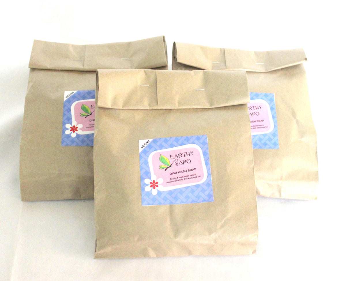 Earthy Sapo Dish Wash Bar packaged in eco-friendly paper covers, made with natural Reetha and Neem for gentle dish cleaning